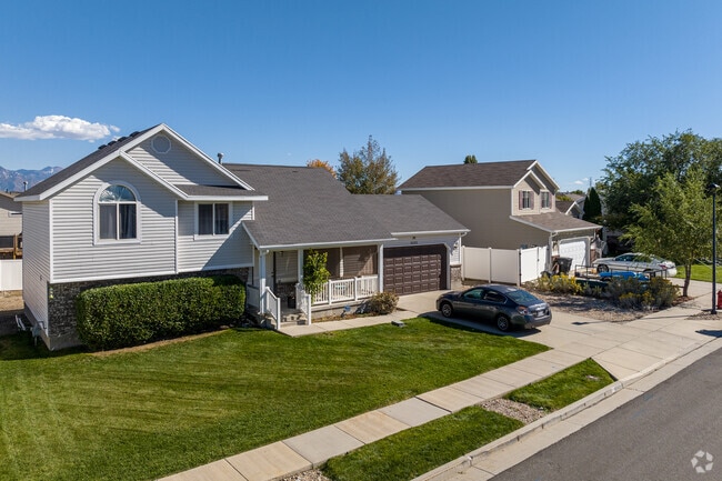 Two story homes with beautiful lawns make are perfect for families in Oquirrh Shadows.
