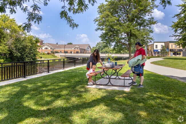 A family enjoys a picnic at Ten Club Park in Waterford.
