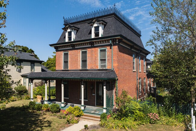This Victorian home in downtown Monroe features a beautiful pillared front porch.