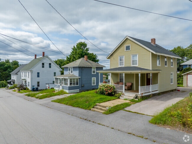 A row of homes in Allenstown is beautifully displayed on a quiet residential street.
