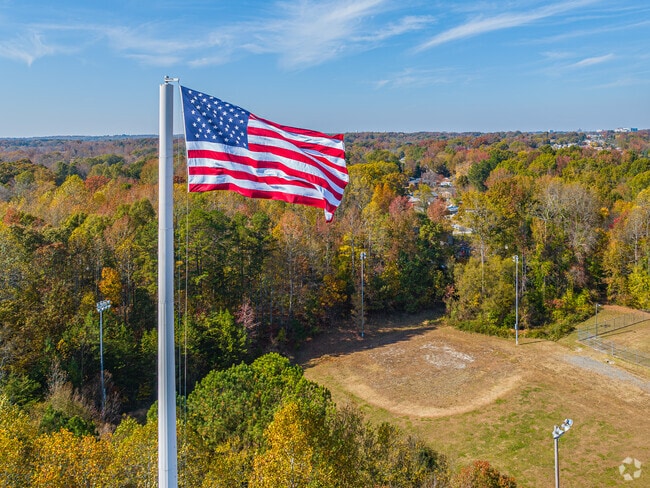 An American flag flies over a baseball field in Archdale.