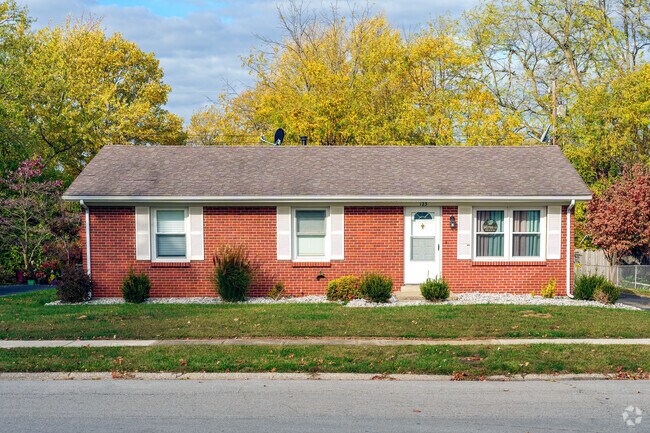 This single-story ranch-style home in Firmantown features mature backyard trees for privacy.