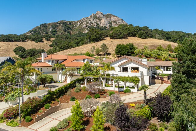Two large homes in Highland have a great view of Bishop Peak and the neighborhood below.