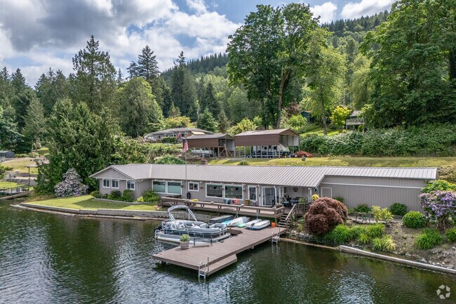 Wake up to the sound of nature's symphony in a Lake McMurray rambler home.