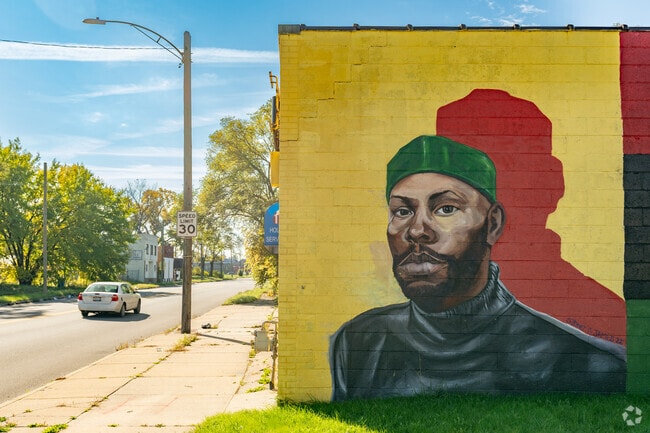 Art murals bring life and color to a quiet part of Conant Gardens.