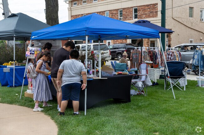 Locals contemplate handmade goods at The Market at Tower Park.
