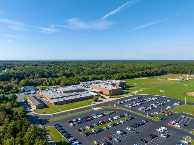 Pinelands Reg High School is surrounded by tress and greenery.