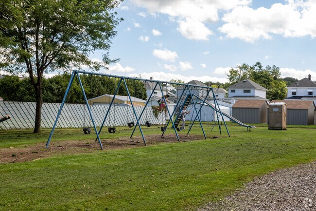 The Archbald Borough playground has swings for kids to play on.