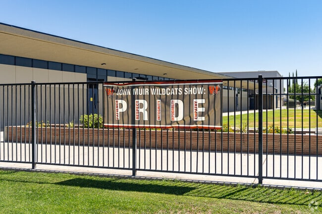 A large banner helps to encourage John Muir Middle School to adopt good behavior.
