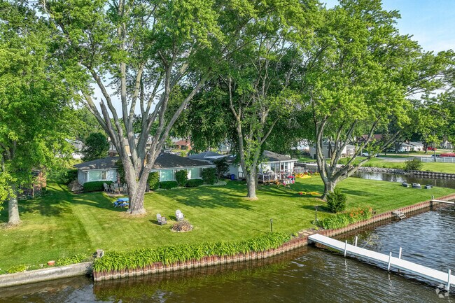 Rows of homes in McHenry Shores are covered by mature trees which shade their homes.