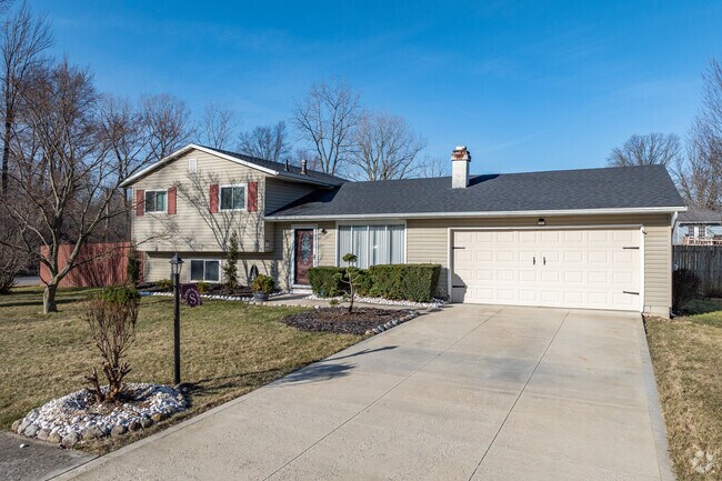 Split-level homes in Sheffield Lake often have attached garages and wide driveways.
