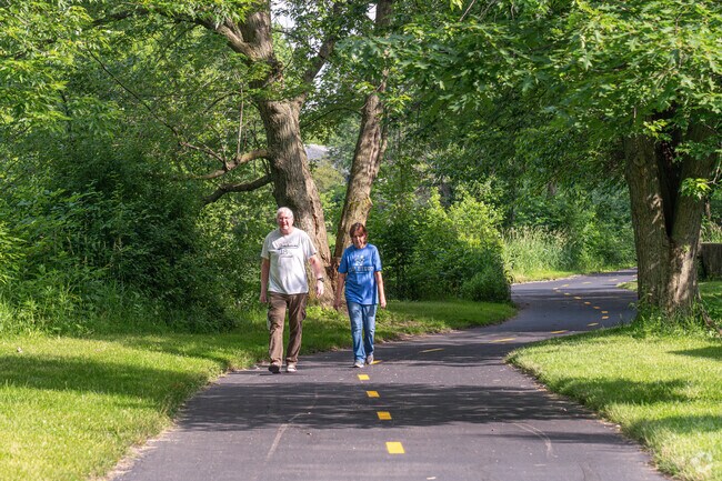 East Highland couple walk down the West Branch DuPage River Trail.