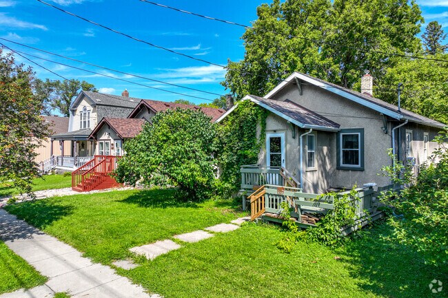 Madison-Unicorn has a variety of homes with lush green grass.