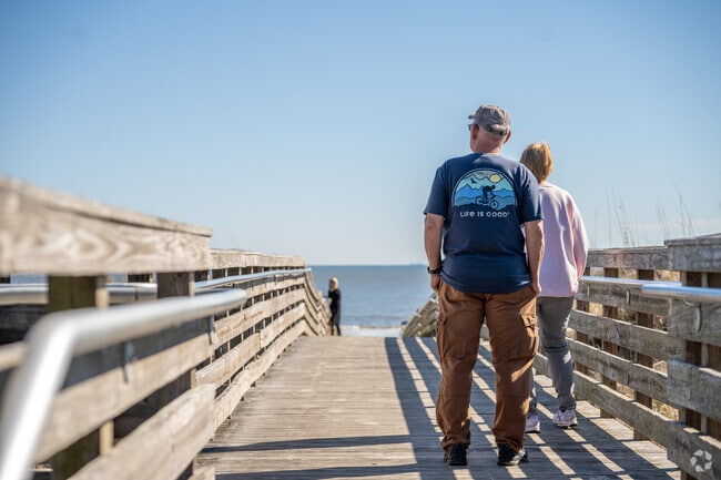 Take in the views from one of Jekyll Island's pier, embracing the moment by the beach.