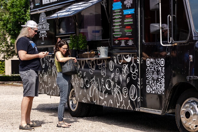 Indulge in tasty bites from food trucks at the Downtown Elgin Market.