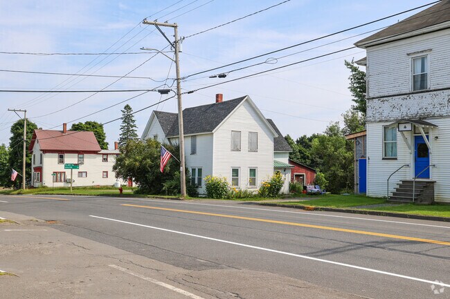 Rows of homes on Rt 159 are positioned closer to the sidewalks in Patten.