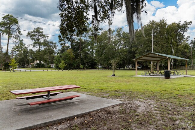 Enjoy the open field or shaded picnic tables at Barjan Terrace Park.