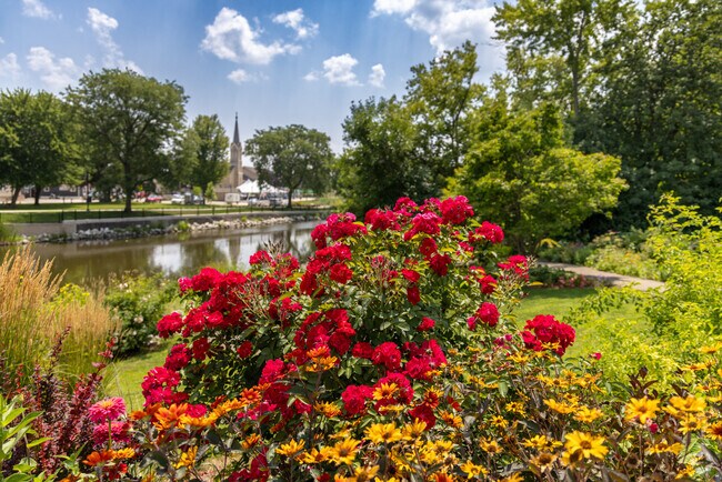 Views from River Bend Park include gorgeous flowers, the Fox River, and a historic church.