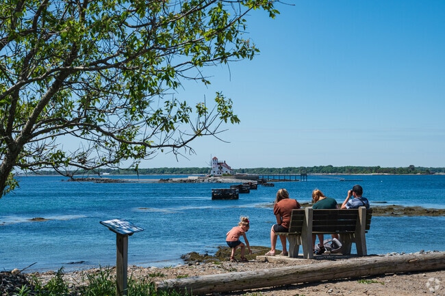 Family visits Fort Foster to enjoy the views.