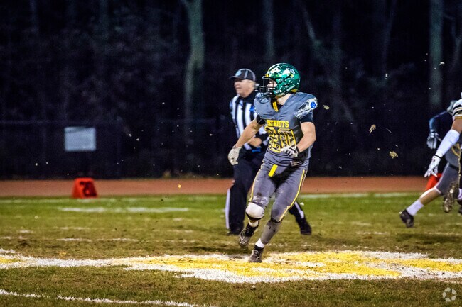 Root on the Ward Melville Patriots at Ward Melville High School.