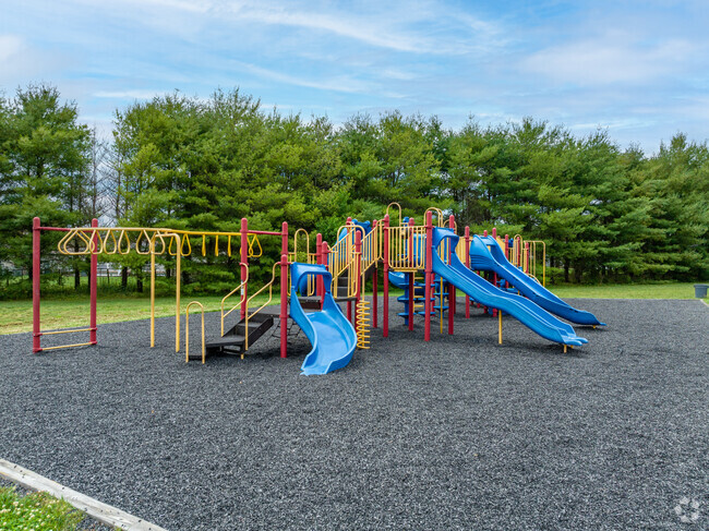 The playground at Adelphia Elementary School is in a park like setting.