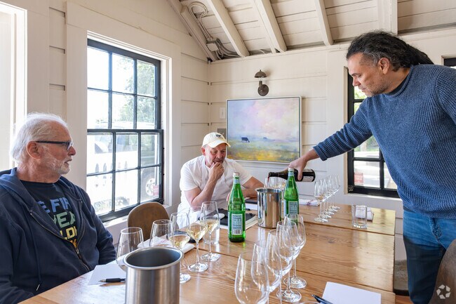 Inverness Saltwater Oyster Depot owner decides on wine pairings for the upcoming menu.