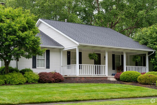 A Cape Cod-style home surrounded by mature trees in the Northmoreland neighborhood.