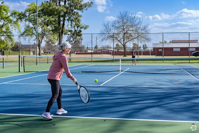 A Rosedale mother and her daughter play a game of tennis at Westdale Park.