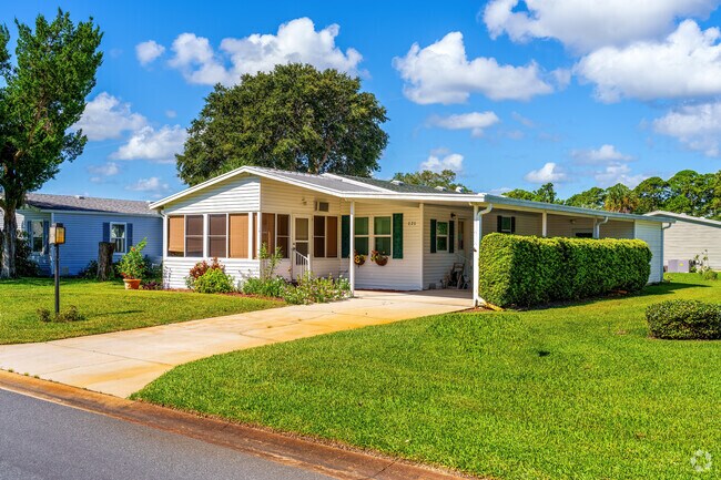 This Edgewater Landing home features a carport for the neighborhood preferred golf cart.