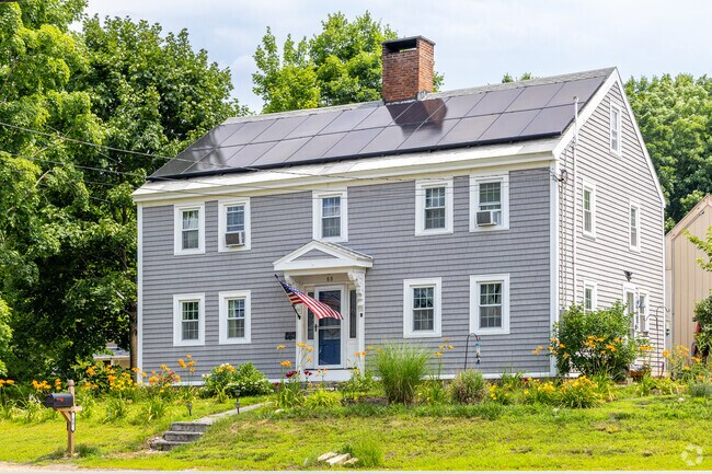 An updated Colonial styled home along main street in Barnstead, NH with solar panels.