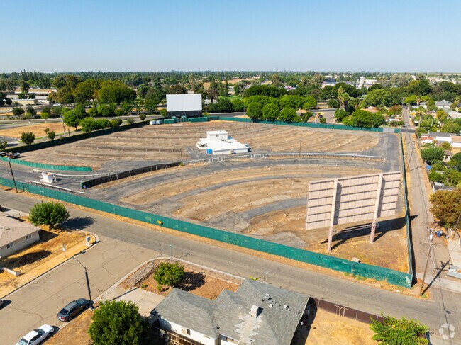 Families arrive at the Madera Drive-In theater in North Madera for an evening movie.