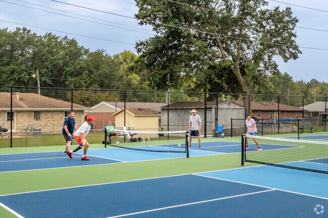 Residents of East Alton grab a game of Pickleball at Kutter Park.