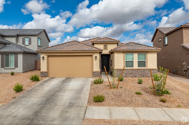 Rocking K homes have gravel yards with a few desert-adapted plants and trees.