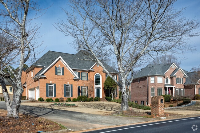 A charming row of Colonial Revival homes nestled in the delightful Doublegate neighborhood.