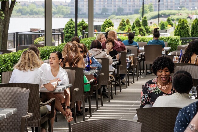 Diners in Edgewater, NJ enjoy lunch at Haven while taking in the views of the Hudson River.