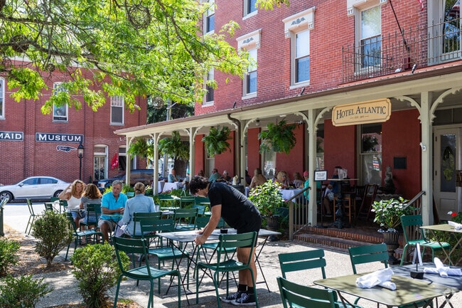 Enjoy outdoor dining at Drummer’s Café in Berlin, with charming views of the historic district.