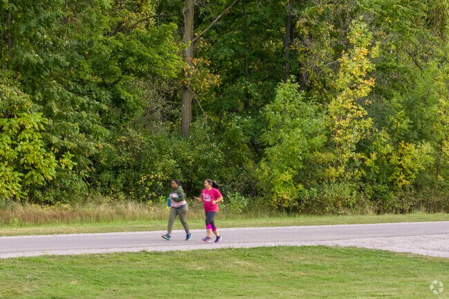 Locals enjoy an afternoon spent jogging at Hoyt Park with friends.