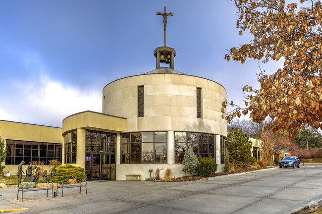 The church is attached to St Robert Bellarmine Catholic School.