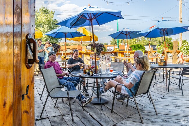 Sit on the patio on a warm day at Rock Rest Lodge in West Pleasant View.