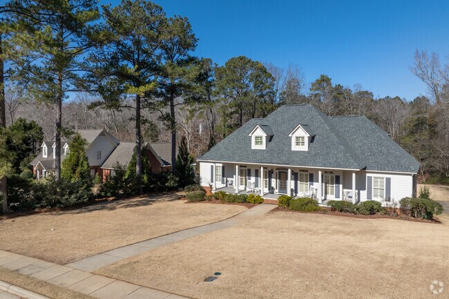 Large front porches provide a place to get together in Moore's Mill.