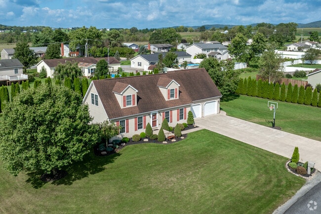 Many homes in Hughesville have large lawns and private spaces.