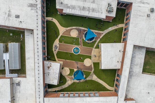 Lobit Elementary School features a courtyard with picnic tables and games.