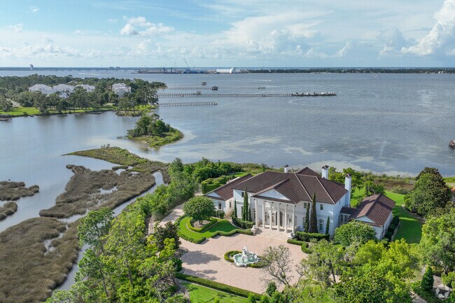 Massive estate homes on the water can be found in upscale gated communities in Upper Grand Lagoon.