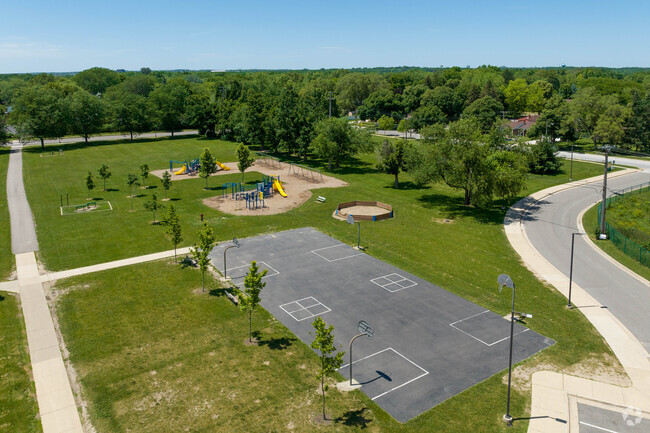 The Mitchell Elementary School playground is next to the Basketball court and blacktop.