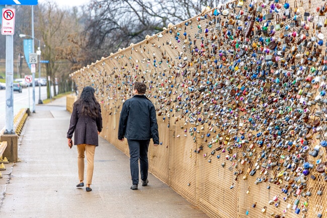 A couple of students walk across the Schenley Bridge in Central Oakland.
