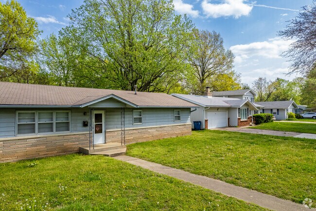 Ranch homes line a neighborhood street in Meador Park.