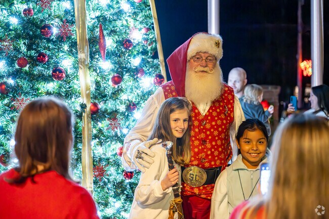 A child poses for a photo with Santa in Bogart.