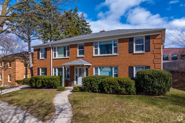 A few duplexes line Honey Creek Parkway in Milwaukee.