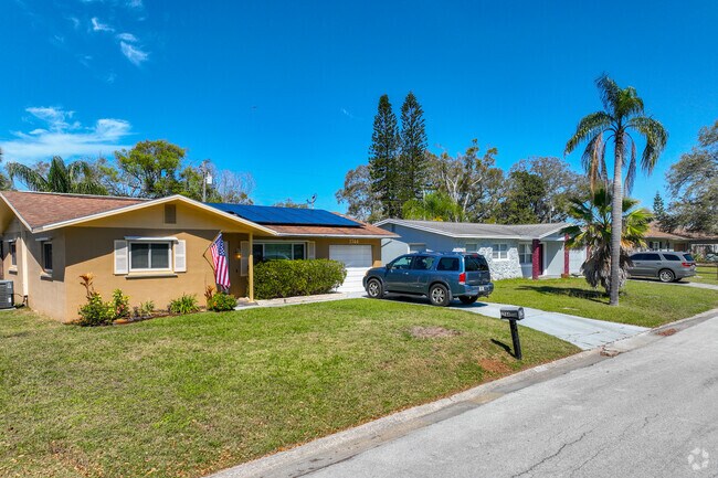 Ranch style homes with garages and driveways are common in Alcove.