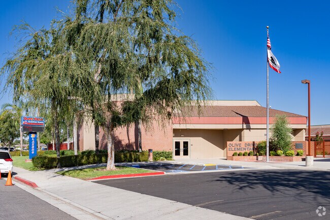 An American flag waves at the entrance to Olive Drive Elementary School in Bakersfield.